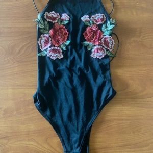 Open backed rose body suit